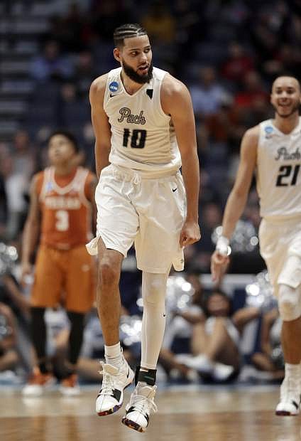 Nevada forward Caleb Martin reacts after sinking a basket in overtime Friday against Texas.