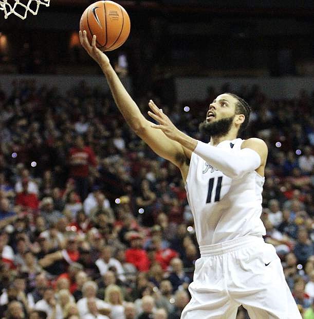 Nevada forward Cody Martin successfully makes an underhand layup Friday in the semifinal game of the Mountain West Conference Championships at the Thomas and Mack Center in Las Vegas.