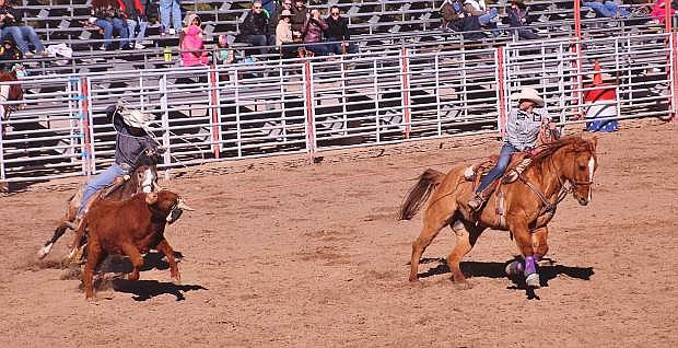 Ali Norcutt, a freshman at Oasis Academy in Fallon, and Cason Webb, a junior at Churchill County High School, ride in a rodeo held last month.