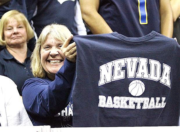 Nevada season-ticket holder Charlotte LaCombe of Carson City shows her support Friday for the Wolf Pack at theThomas &amp; Mack Center.