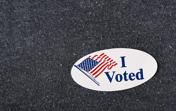 Closeup of an American &quot;I voted&quot; sticker placed on a navy shirt.