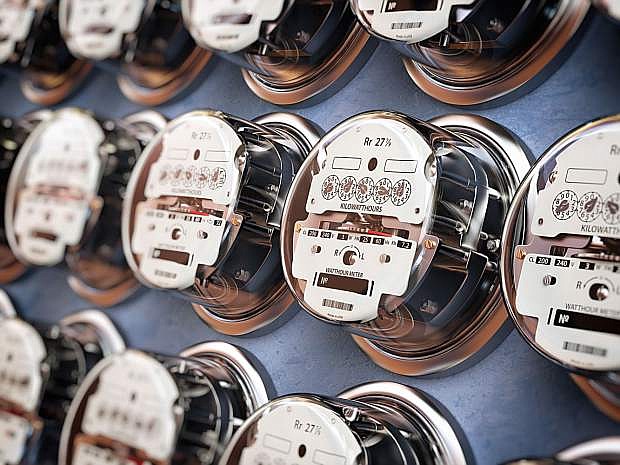 Electric meters in a row measuring power use. Electricity consumption concept. 3d illustration