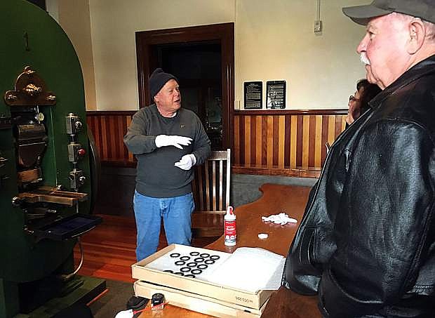 Nevada State Museum volunteer Cliff Dunseth talks about the history of Coin Press No. 1 to museum visitors. The museum will be holding a two-day training session for new and existing volunteers March 26-27.