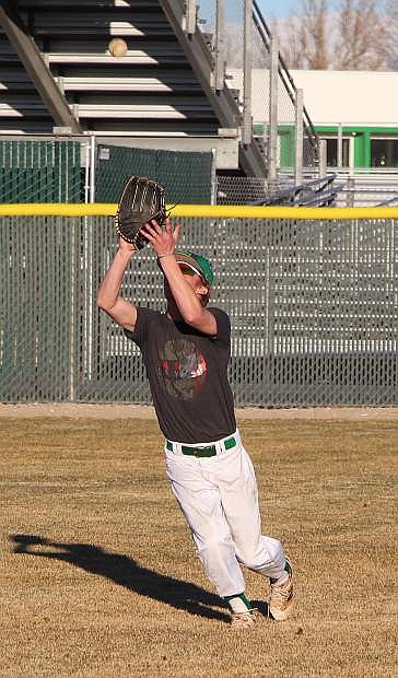 Fallon senior Jake Wickizer fields a flyball during practice this week.