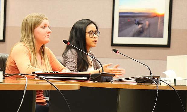 Emily Marshall, left, and Kyla Fabian, right, both students Churchill County High School and members of Students Taking On Prevention, request support for raising the minimum legal sales age for tobacco products in the state to Churchill County Commissioners Wednesday.