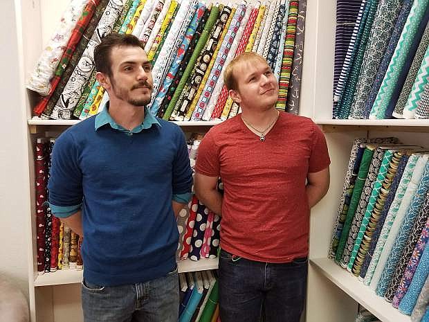Brothers Joshua and Ian Denfords look at some of the 300,000 yards of fabric they now have on sale a Out of My MinDesigns.