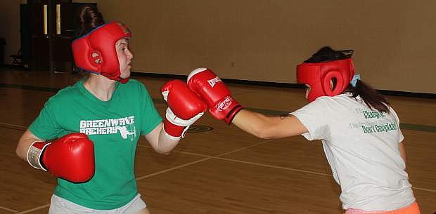 Sawyer Gregersen, left, and Alexis Jarrett go through a 30-second sparring session.
