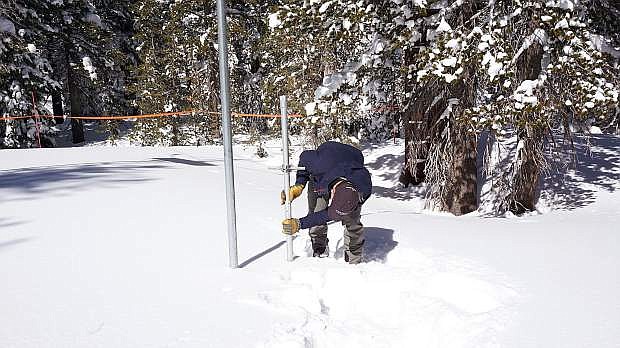 Jeff Anderson, hydrologist for the Natural Resources Conservation Services, measures the snowpack on Mt. Rose on Monday.