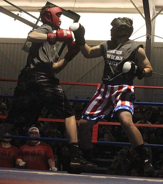 Johnathan &quot;King of Pain&quot; Blakey, right, parries a punch by Kendall &quot;Too Tall&quot; Rogers during the second bout of the Night of Fights in 2017.