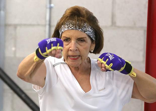 Gloria Navarro warms-up with a jabbing drill at the beginning of the hour long Parkinson&#039;s boxing program.