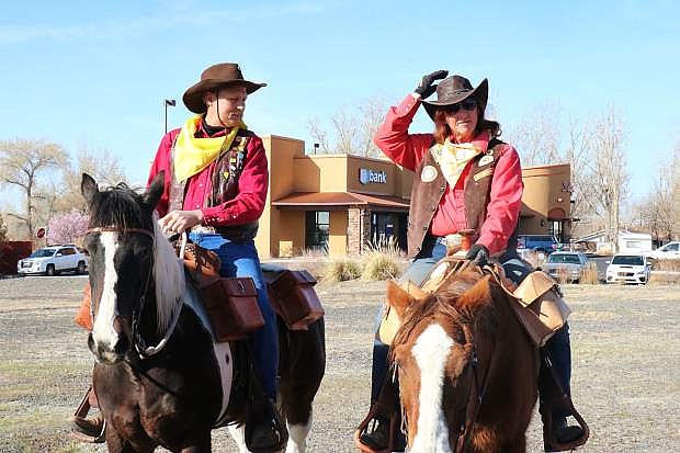 Representatives of the Pony Express Nevada Division, President Arthur Johnson, left, and Tresurer Jill Andrews, right, attend the ribbon cutting ceremony of the Pony Express statue Tuesday morning.