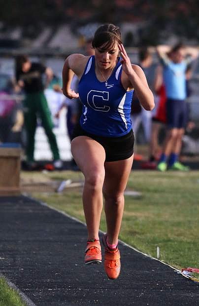 Carson High&#039;s Abbey Paulson competes in the triple jump on Friday at Reed High.