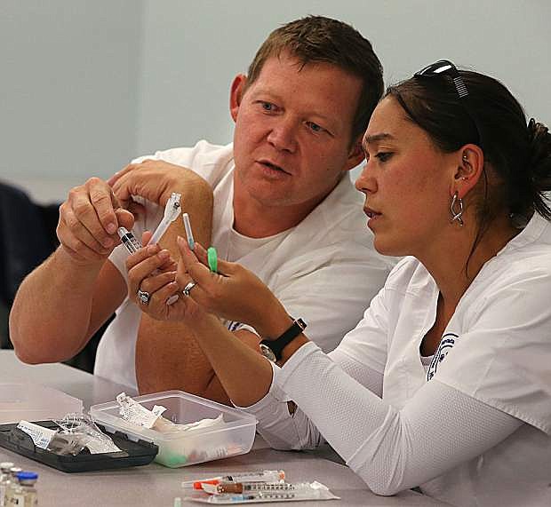 Joseph Yeargan and Niki Perry work in a nursing class at Western Nevada College in Carson City.