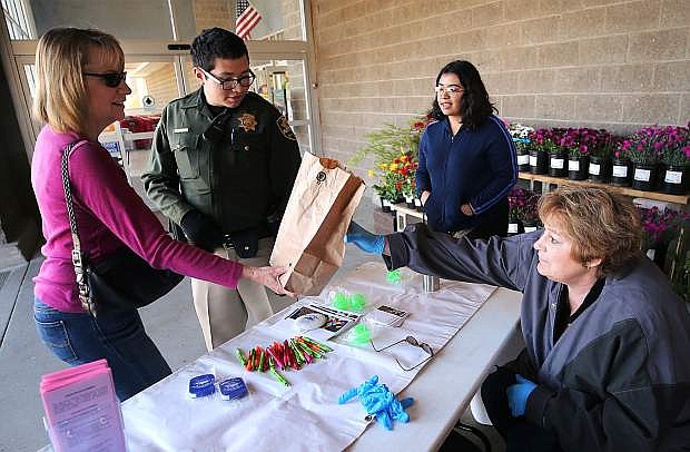 Carson City residents turned in over 500 pounds of pills and 150 pounds of needles during the Partnership Carson City drug roundup in Carson City, Nev., on Saturday, April 28, 2018. Photo by Cathleen Allison/Nevada Momentum