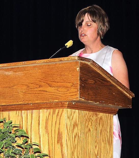 Lynn Strasdin, director of the Adult Diploma Program, opens the graduation ceremony.