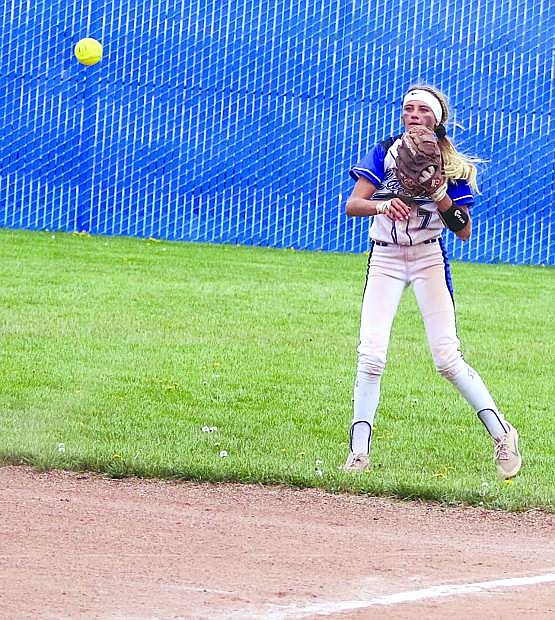 Carson second baseman Kedre Luschar throws out a Douglas runner in the seventh inning of Carson&#039;s win over Douglas on Saturday.