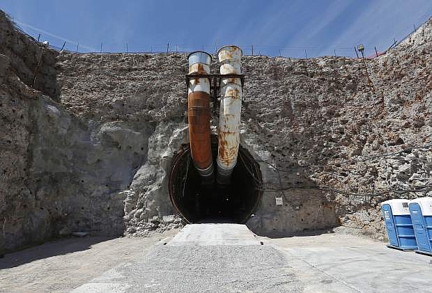 FILE - This April 9, 2015, file photo shows the south portal of the proposed Yucca Mountain nuclear waste dump near Mercury, Nev. The House is moving to approve an election-year bill to revive the mothballed nuclear waste dump at Nevada&#039;s Yucca Mountain despite opposition from home-state lawmakers. (AP Photo/John Locher, File)
