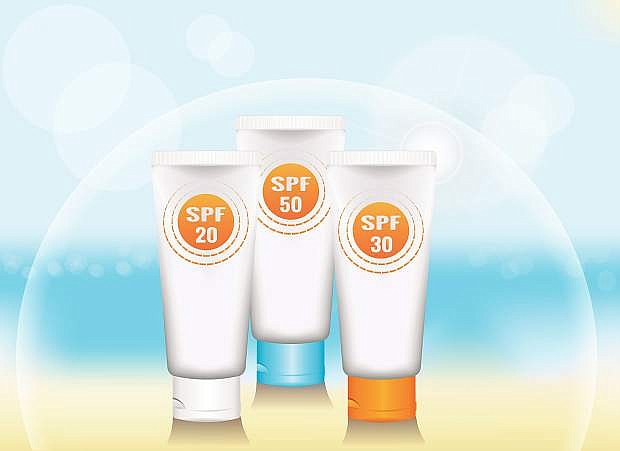 a set of blank vertical tube for cosmetic product on a background of sea beach. colored caps. signs SPF. the symbolic dome of protection. realistic template for advertising. vector illustration