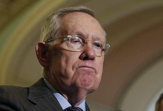 FILE - In this Nov. 16, 2016 file photo, Senate Minority Leader Harry Reid of Nev., pauses during a news conference on Capitol Hill in Washington. Reid is recovering after quietly undergoing surgery Monday. (AP Photo/Alex Brandon)