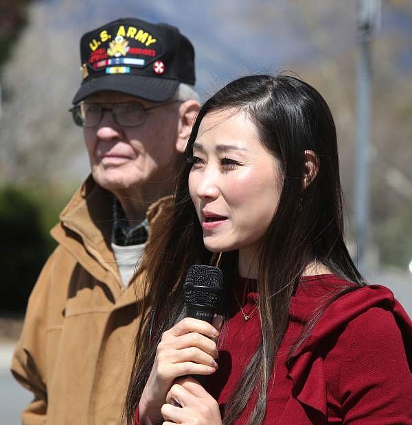 Hannah Kim an advocate for Korean War Veterans visits and speaks to community members at the Carson City Korean War Memorial on Tuesday morning. Looking on is Billy Heinz, president of the Korean War Veterans Association Carson City Chapter #305.