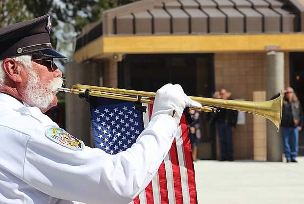 A bugler plays Taps at the Northern Nevada Veterans Memorial Cemetery, which will have its annual Memorial Day ceremony on Monday at 11 a.m.