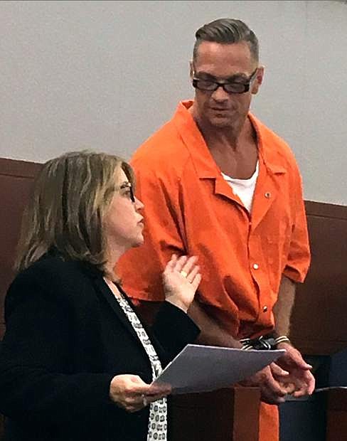 Nevada death row inmate Scott Dozier, right, confers with Lori Teicher, a federal public defender involved in his case, during an appearance in Clark County District Court in Las Vegas on Aug. 17.