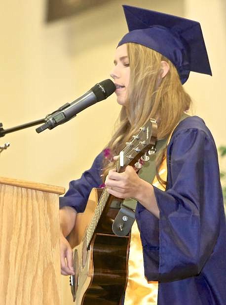 Valedictorian Aleyna Gilson sings a song for her classmates and the audience Saturday at Sierra Lutheran graduation.
