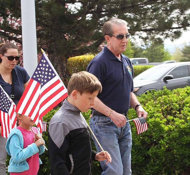 Mayor Bob Crowell walks with a group of kids.