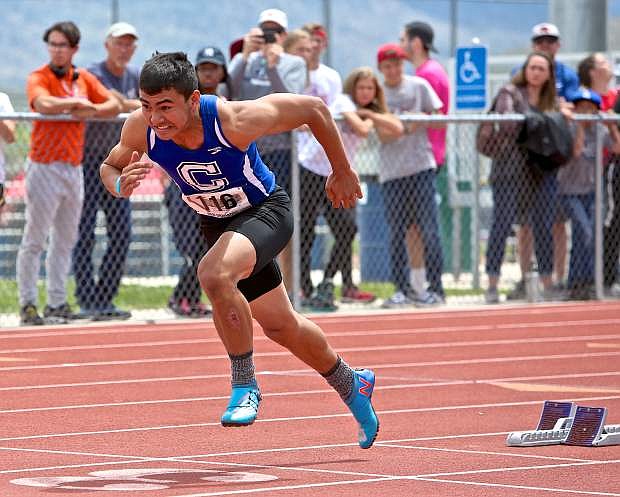 Carson&#039;s Ben Granados explodes out of the starting blocks Saturday during the 4A boys 200-meter dash.