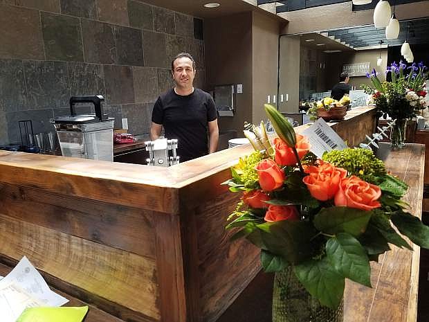 Randy Letter stands behind Saffron&#039;s juice bar. Letter owns and operates the new Carson Street restaurant with chefs Arsalan Tavakoli and Shima Tavakoli.