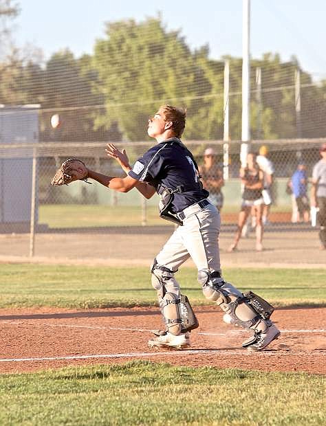 Carson junior all-star catcher Jacob Mathison makes a catch on a Reno pop-up toward the end of the game Wednesday.