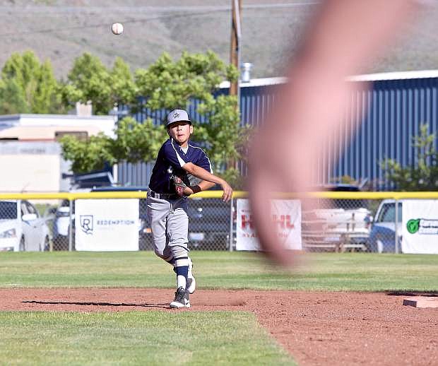 Carson 11-year-old all-star Jeremy Hernandez makes a throw to first from his shortstop position Thursday evening at Governor&#039;s Field.