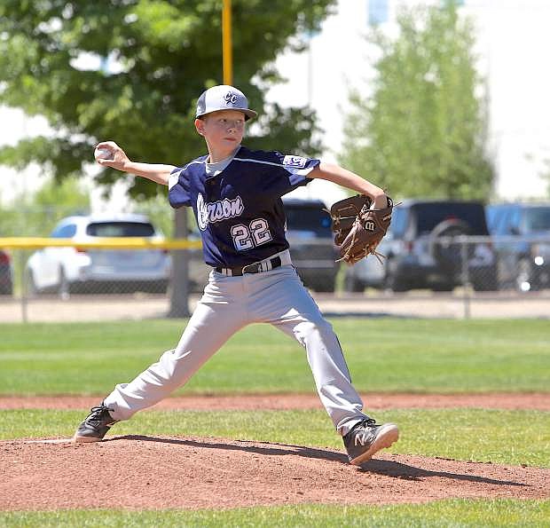 Tyler LaFollette fires strike three to a North Tahoe batter Saturday during 11-year-old all-star tournament play.