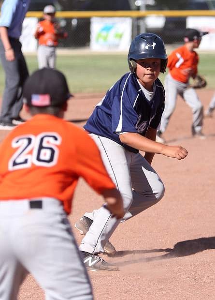 Ethan Cook gets caught in a rundown in a game against Carson Valley on Tuesday.