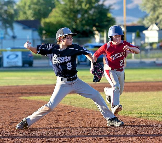Carson White fires the ball to home after scooping up a Truckee grounder Thursday at Governors Field.