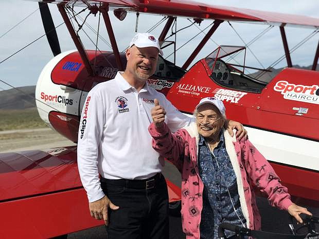 Ageless Aviation Dreams Foundation founder Darryl Fisher and Fernley Estates Senior Living resident Loraine Silva are all smiles after a 20-minute dream flight in a 1943 Boeing-Stearman biplane at Tiger Field in Fernley.