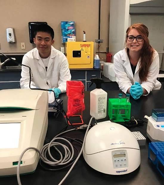Yaowei Deng and Kathryn Bradley in a lab.