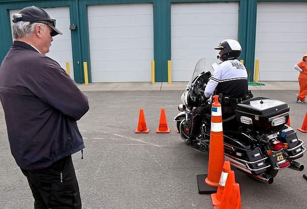Retired state police motor officer Tom Seeley observes CCSO motor deputy Wayne Wheeler recently in Carson City.