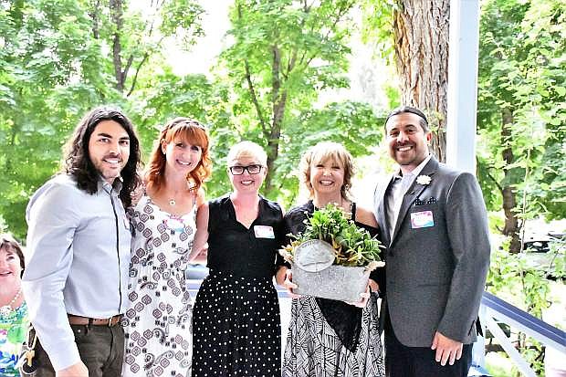 Nick Aliburti, Tara Burke, Sierra Scott, and Carol Scott, and Mark Salinas, Carson City arts and culture coordinator, stand on the porch of the Bliss Mansion, after accepting an honor on behalf of Jeffrey Scott, a former Cultural Commission member who passed away on 2010.