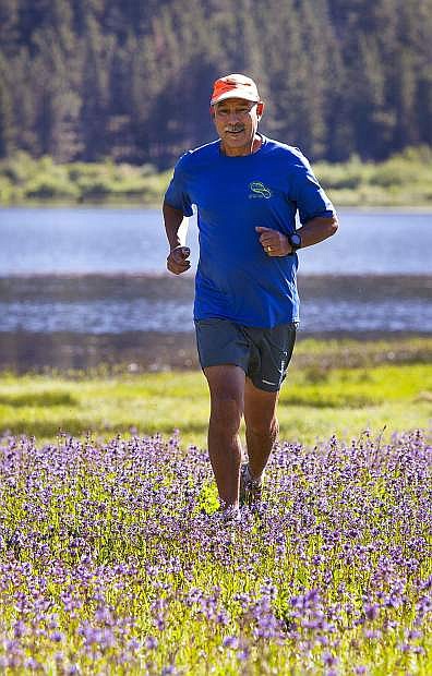 George Ruiz, director of the Tahoe Rim Trail Endurance Runs, runs at Spooner Lake, near Carson City in 2017.