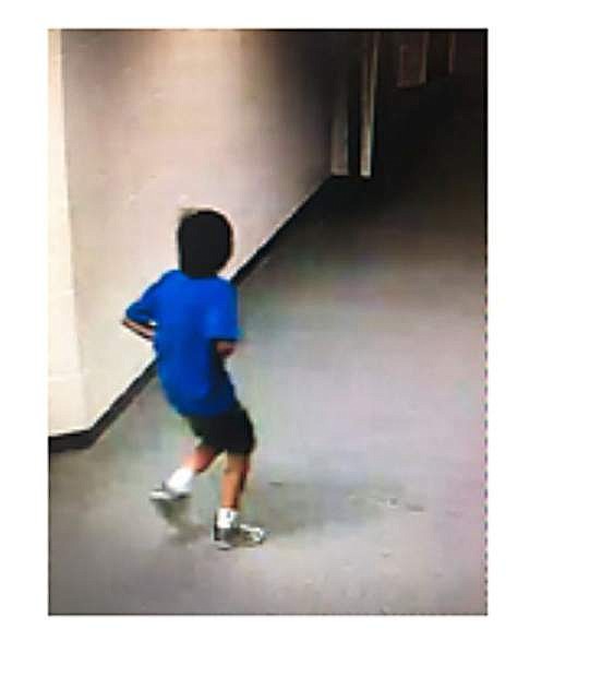 A suspect in vandalism at Pau Wa Lu school is a male, 9-12 years of age with dark, collar-length hair, wearing a blue T-shirt, dark shorts and light colored athletic shoes.