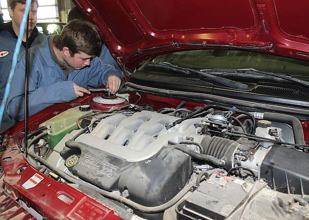 In this photo from 2015, a Churchill County High School student works on a car as part of the CTE program.