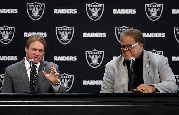 In this Jan. 8, file photo, Oakland Raiders new head coach Jon Gruden, left, answers a question next to general manager Reggie McKenzie during an NFL football news conference in Alameda, Calif. There&#039;s talk the Raiders could hold their training camp in Reno.