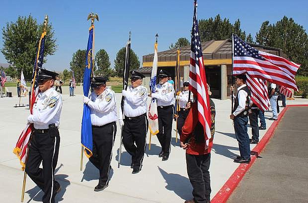 Members from the Nevada Veterans Coalition march to the pavilion to post the colors.