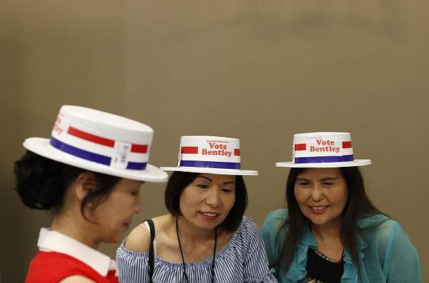From left, Alice Xie, Kiki Lin and Melody Wong attend an event to meet political candidates, Tuesday, Aug. 28, 2018, in Las Vegas. Candidates running for office in Nevada are making a concerted effort to reach out to Nevada&#039;s growing Asian-American and Pacific Islander community with the hope that those voters will swing tight races in the battleground state. (AP Photo/John Locher)