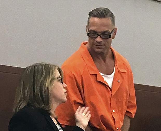 FILE - In this Aug. 17, 2017, file photo, Nevada death row inmate Scott Raymond Dozier, right, confers with Lori Teicher, a federal public defender involved in his case, during an appearance in Clark County District Court in Las Vegas. Two drugmakers are asking Nevada Supreme Court to let a lower court hear arguments before taking up an appeal about whether the state can use their products for an execution. Court filings Monday, Aug. 13, 2018, leave it up to Nevada&#039;s highest court to decide how to proceed with a prisons effort to reschedule Dozier&#039;s twice-postponed lethal injection. (AP Photo/Ken Ritter, File)