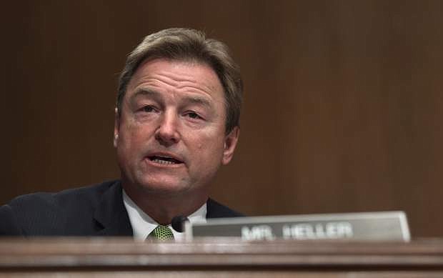 FILE - In this Jan. 30, 2018, file photo, Sen. Dean Heller, R-Nev., asks a question during a Senate Banking Committee hearing on Capitol Hill in Washington. Heller, considered the most vulnerable GOP senator seeking another term this year, opposed measures to dismantle President Barack Obama&#039;s signature law before backing other versions that failed. (AP Photo/Susan Walsh, File)