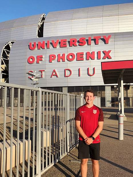 Sierra Lutheran High School graduate Ryan Salerno stands in front of Univeristy of Phoenix Stadium in Arizona. Salerno works for the Arizona Cardinals.