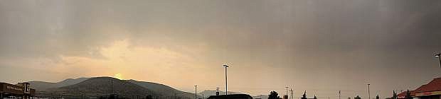 This panoramic photo taken Monday night from the Raley&#039;s parking lot at sunset shows the obscured view by smoke from wildfires in the region.