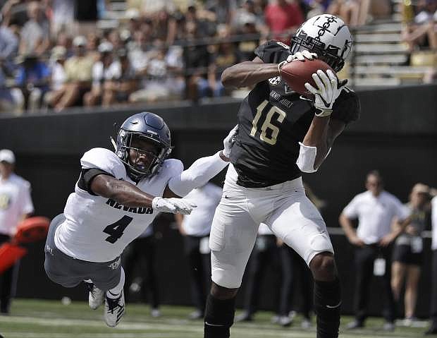 Vanderbilt wide receiver Kalija Lipscomb (16) catches a 2-yard touchdown pass ahead of Nevada defensive back EJ Muhammad (4). Nevada can forget about Vanderbilt and move on to Oregon State, Joe Santoro writes.